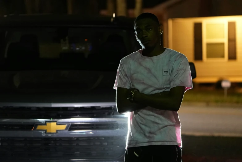 a person standing in front of a truck on the street