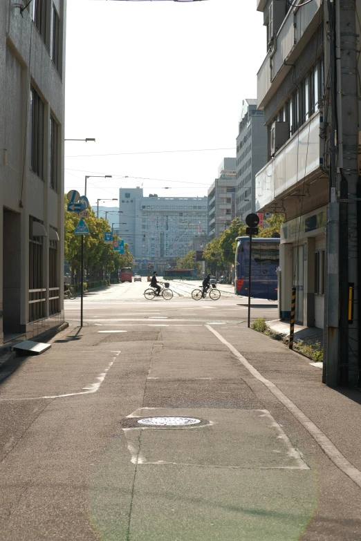 an empty street with two bicycles parked on the right