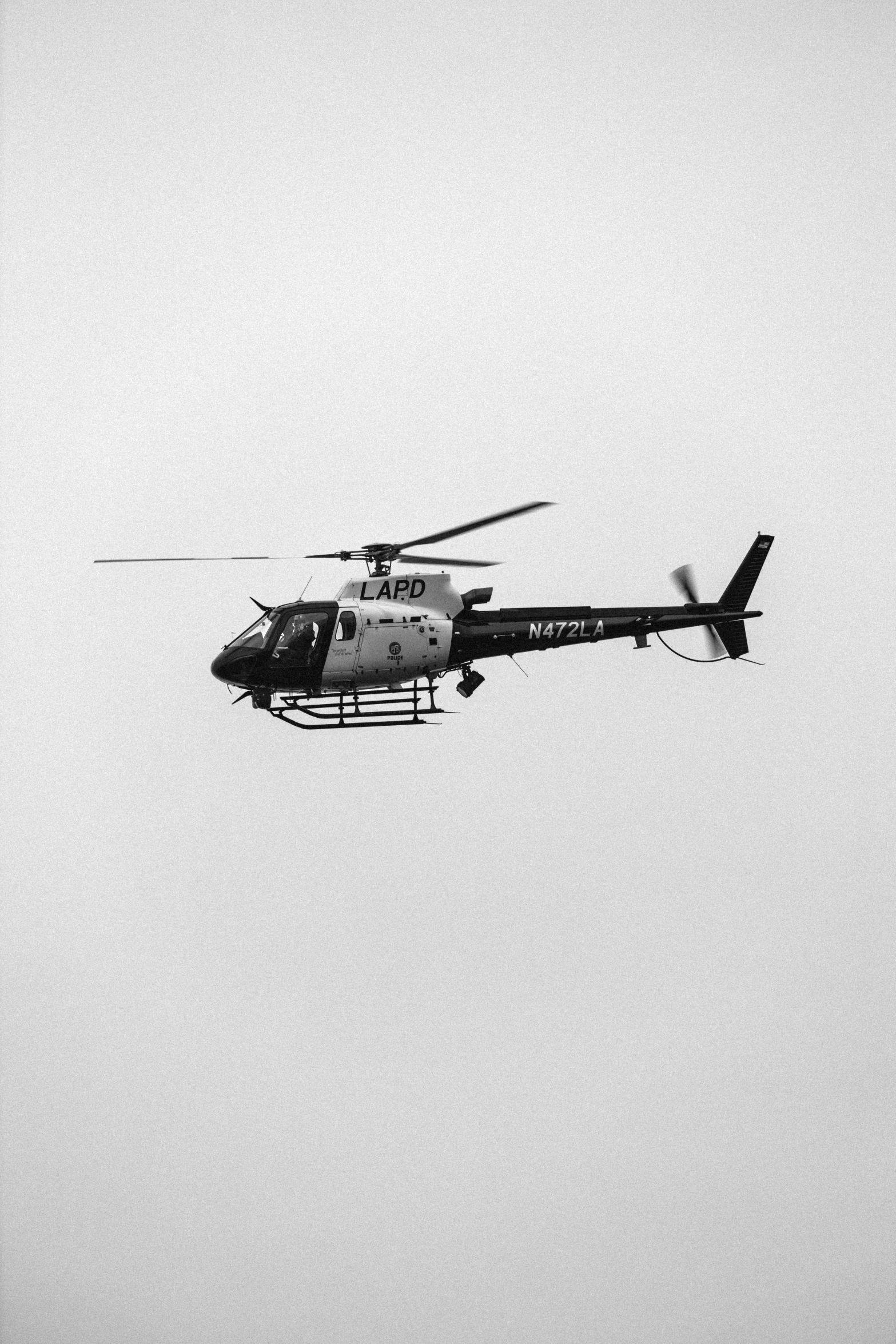 a helicopter in the sky on a hazy day