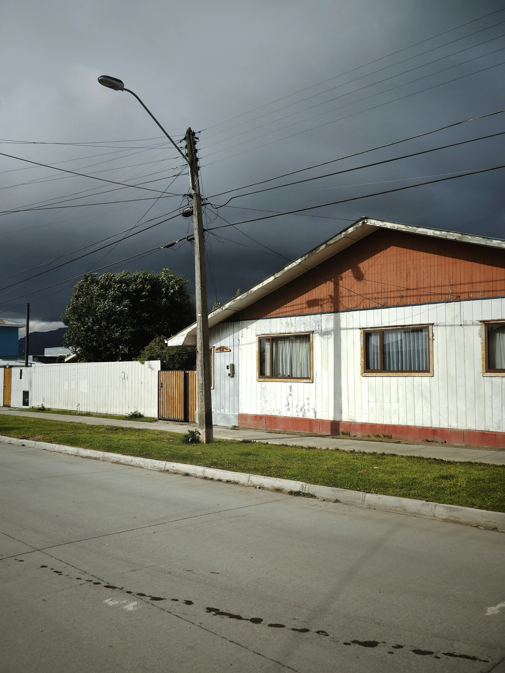 a street scene showing a building with three windows