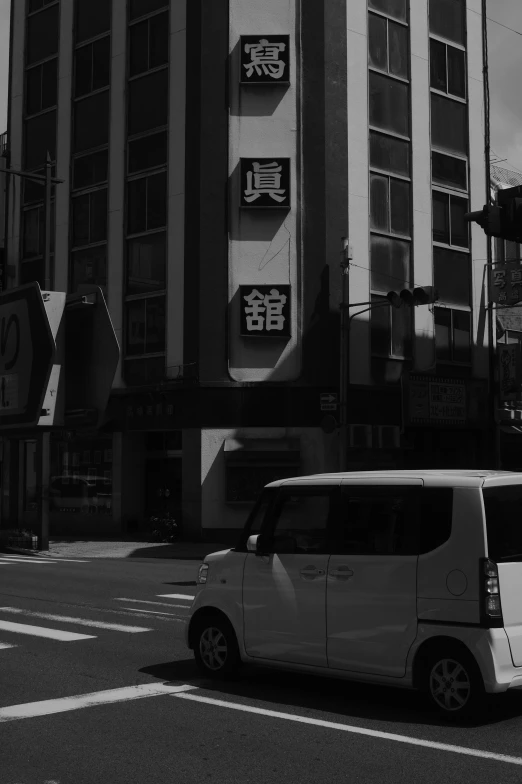 an asian city with many large buildings and signs