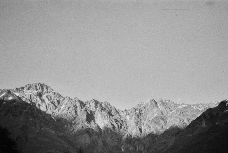 a mountain range in the background, with clouds