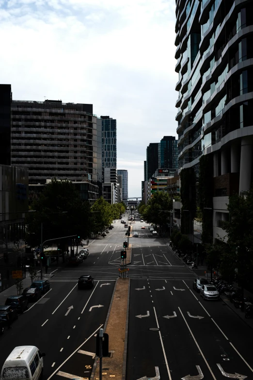 a city street is lined with tall buildings and pedestrian traffic