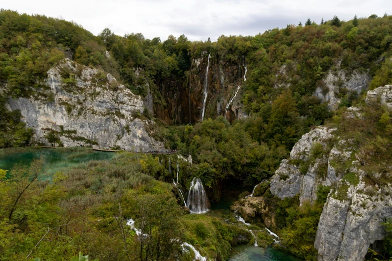 an aerial view of waterfalls and other things in a forest