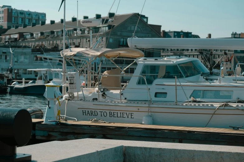 several boats are moored at a small dock