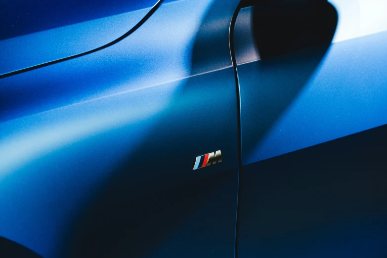 the tail light of a car in blue is shown