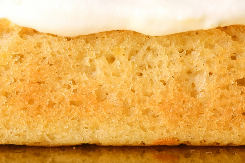 close up of a glazed and vanilla piece of bread