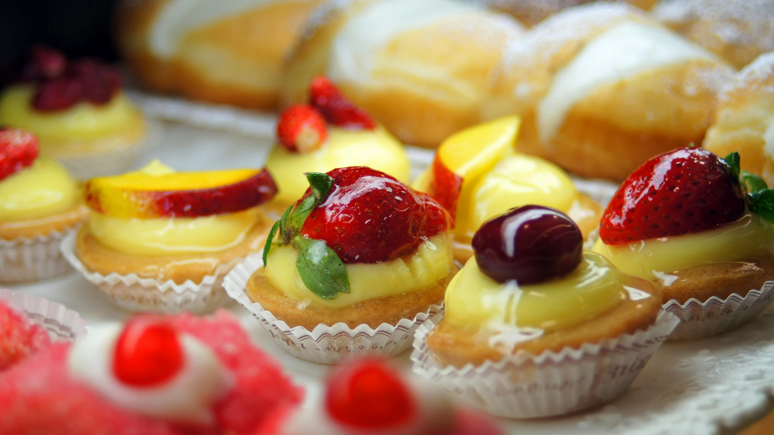 assorted fruits and vegetables on top of mini muffins