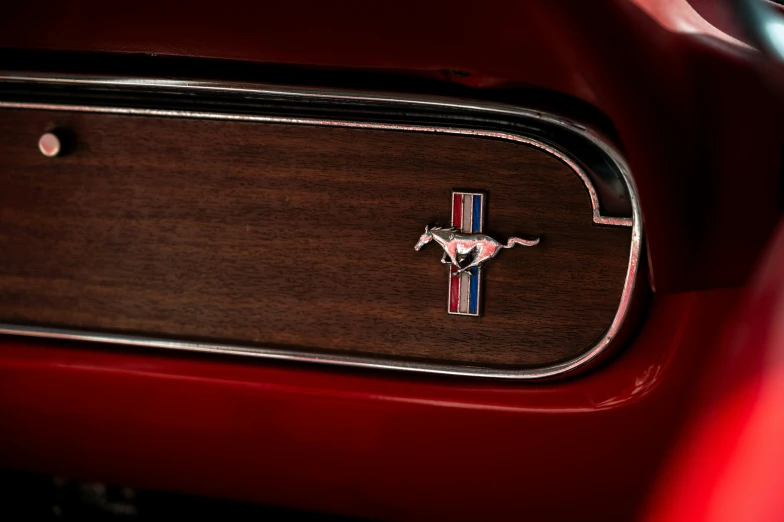 a mustang badge on a car front view