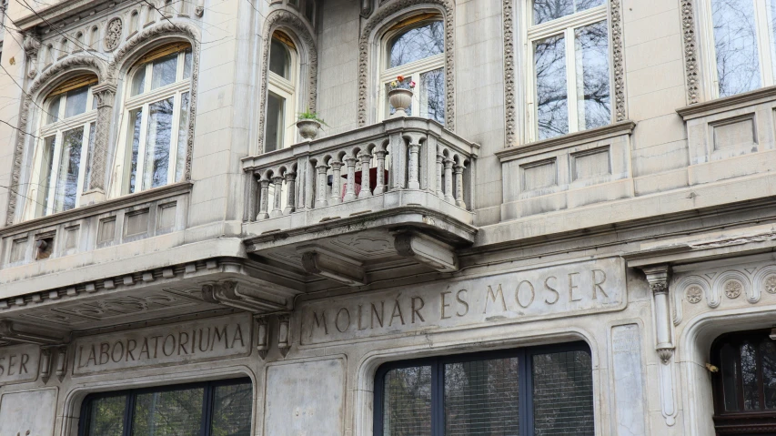 a large building with many windows and a balcony