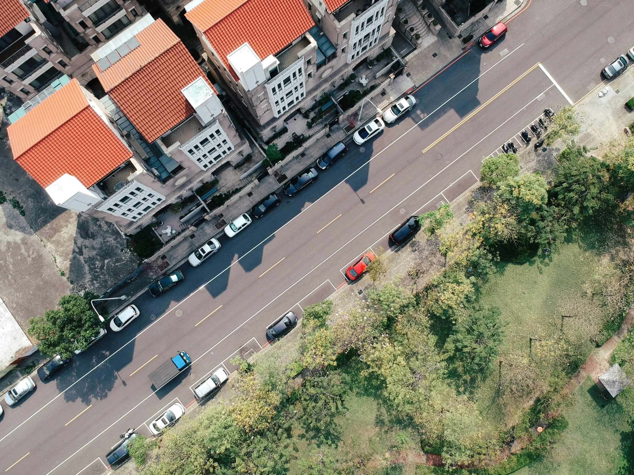 an aerial view of a city with many cars