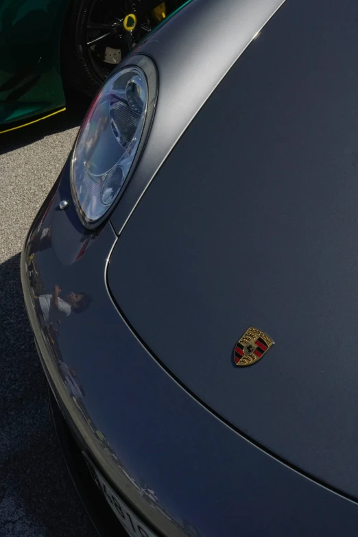 a close up of a sports car's emblem