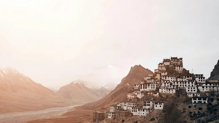 a mountainous village sits on top of a mountain