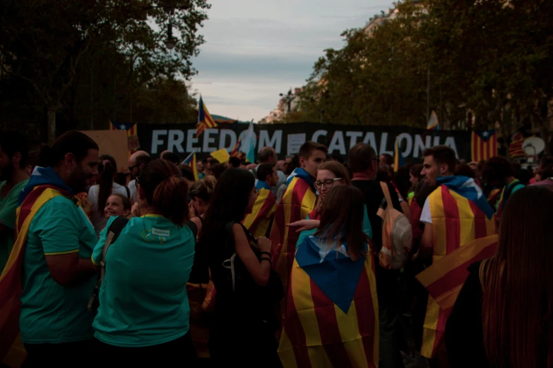people gathered outside protesting about a catalonia