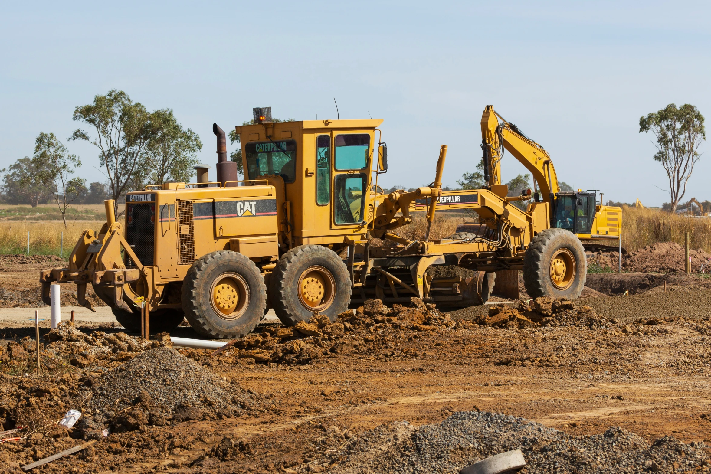 there is a construction truck next to a machine