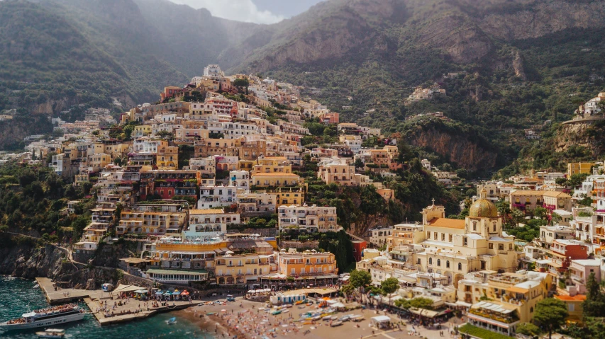 a very colorful city on the shore of a body of water