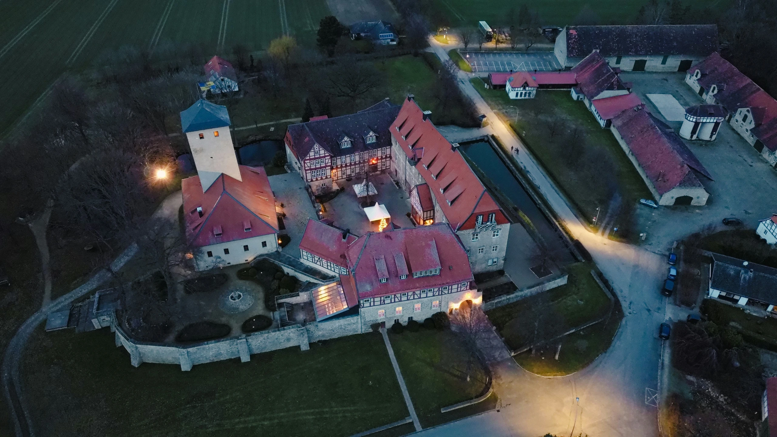 an aerial view of a town with its red roofs