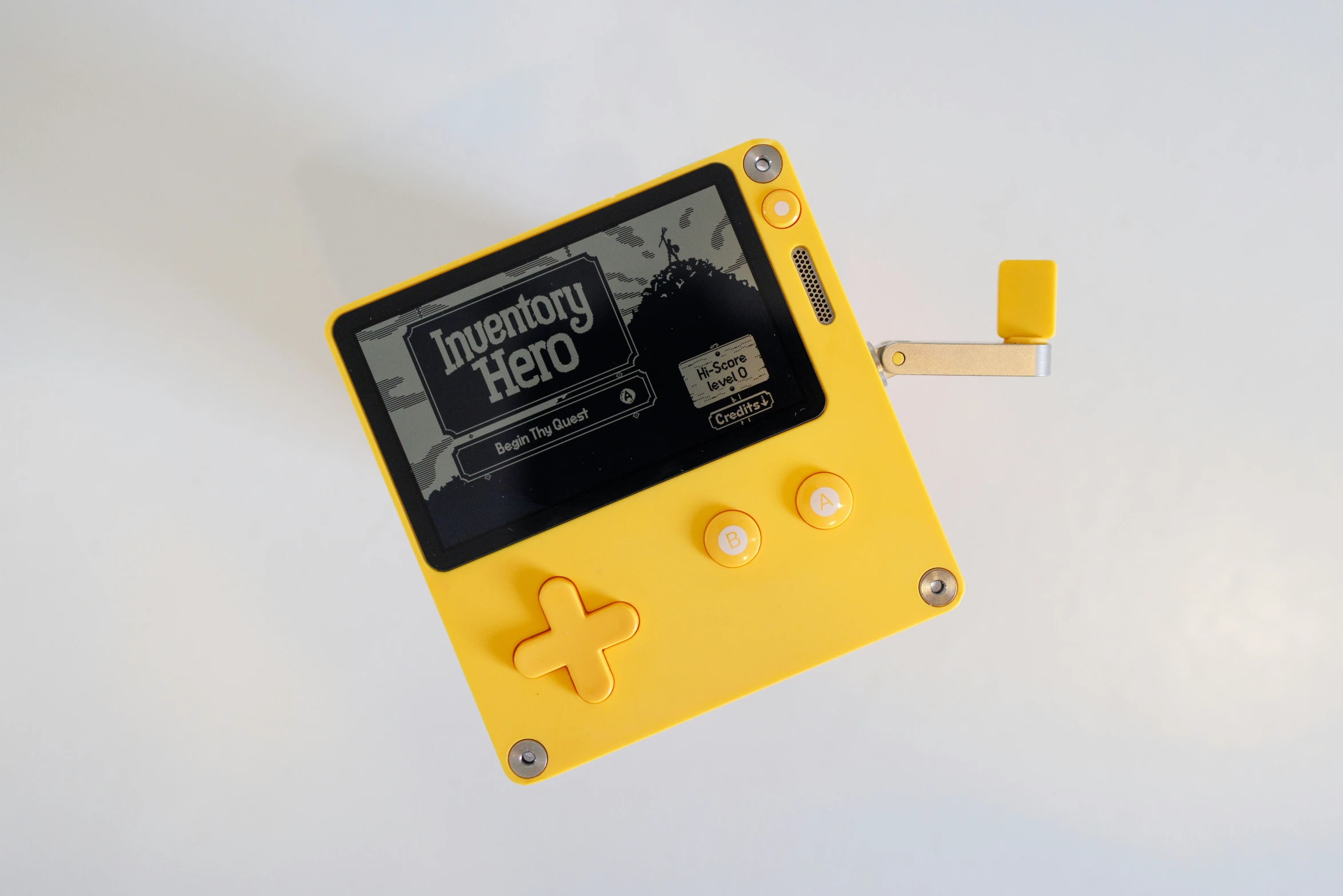 a yellow gameboy is shown with a pair of white studs