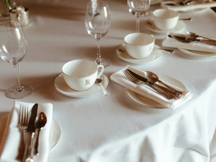 a table is set for two with utensils and silverware