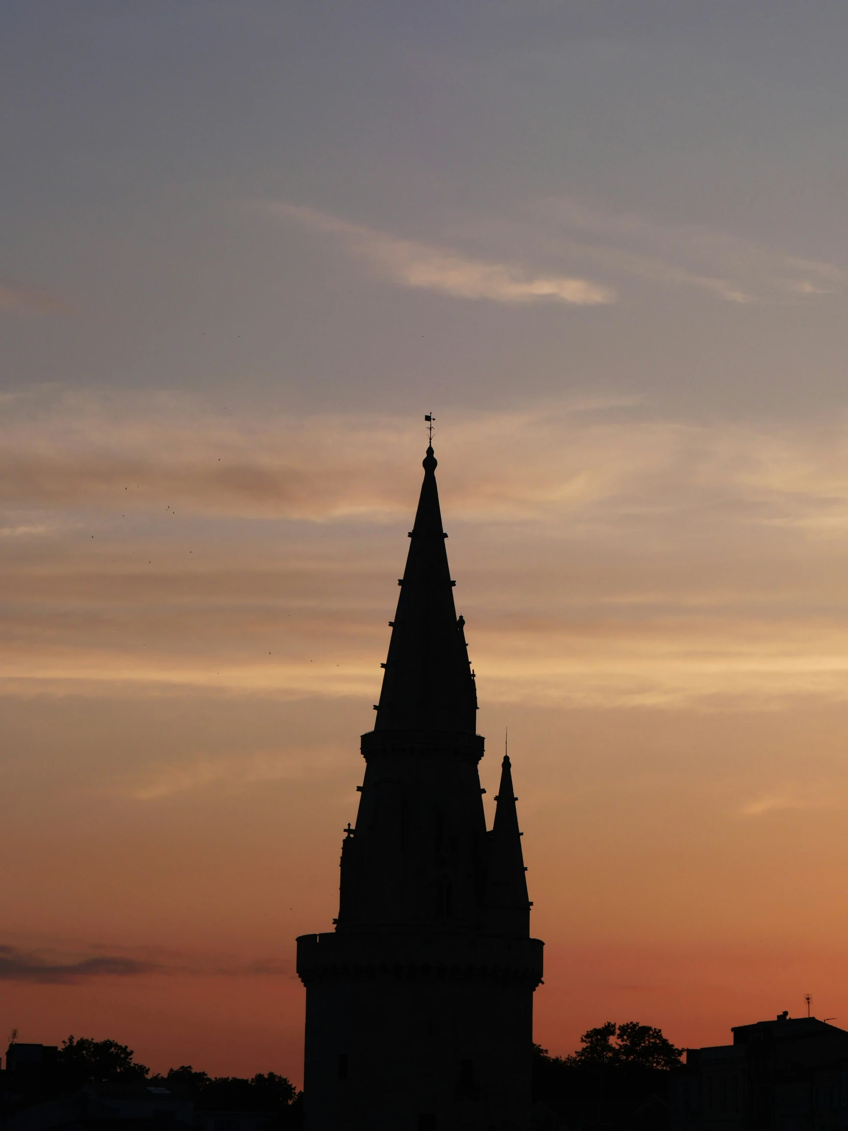 a large tall tower with a clock on the side of it