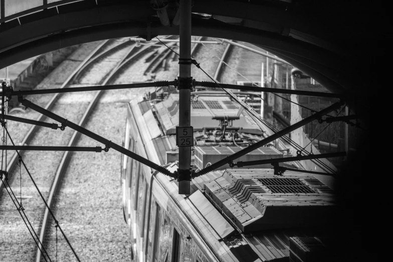 this black and white po shows the view down at a train track