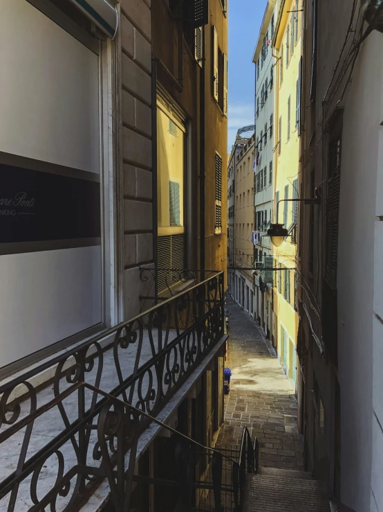 this looks down a city street lined with yellow buildings