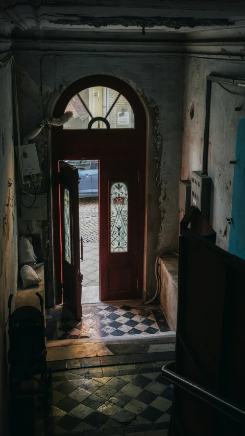 a small room is shown with old furniture and a door