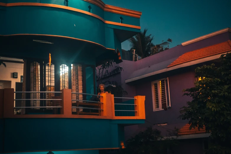 a balcony overlooking a multi - story apartment with trees in the backgroud