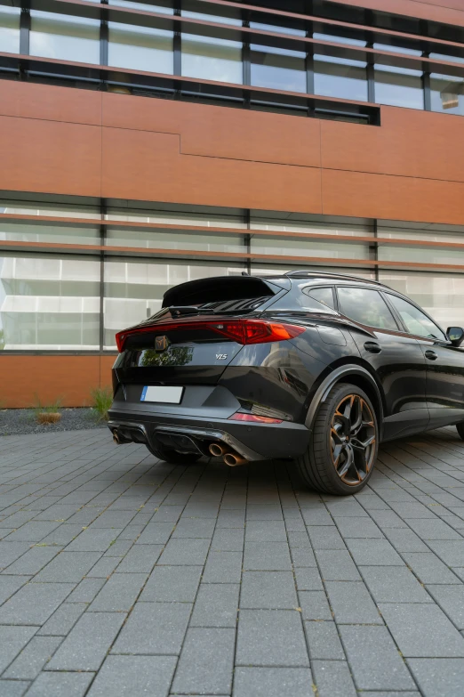 a black suv parked in front of a building