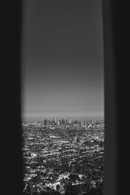 a city with a tower and very tall buildings is seen from a distance