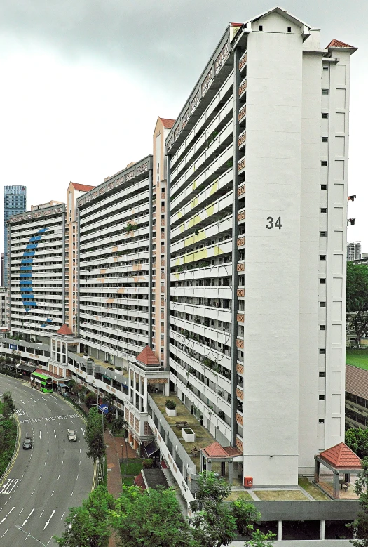 the tall buildings are both very large and have balconies