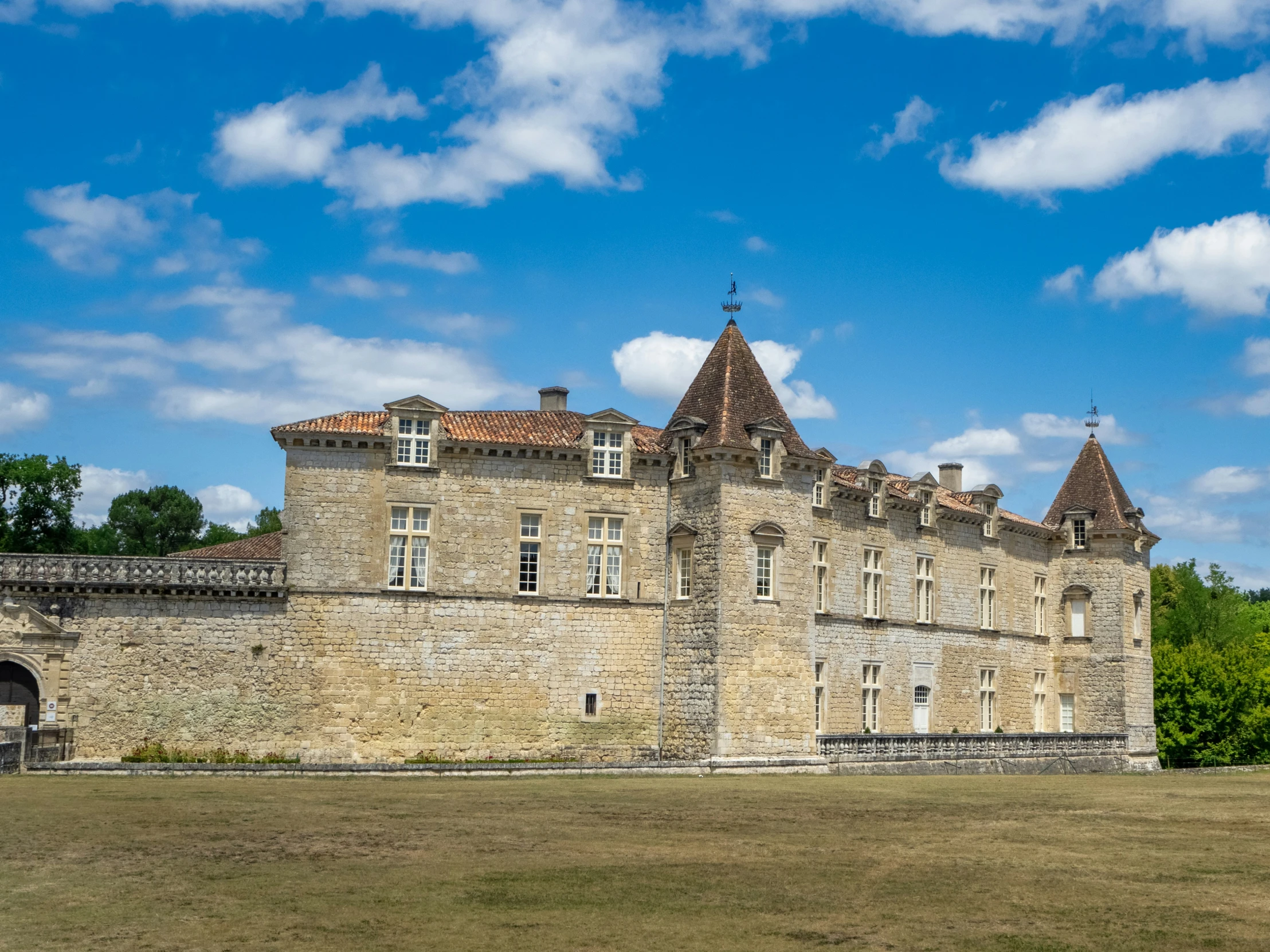 an image of an old castle with the grass in front of it