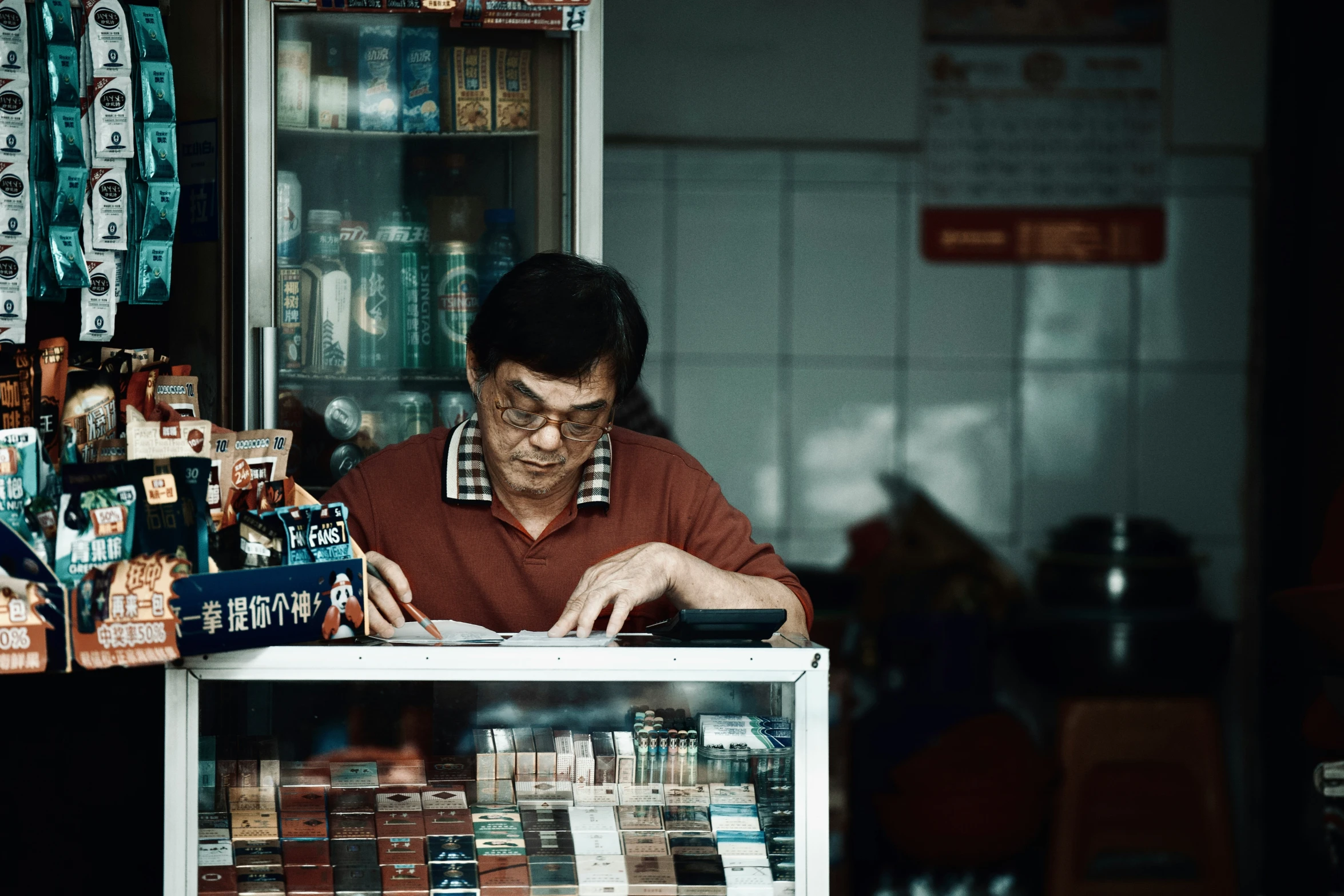 a man using a laptop computer sitting at a desk