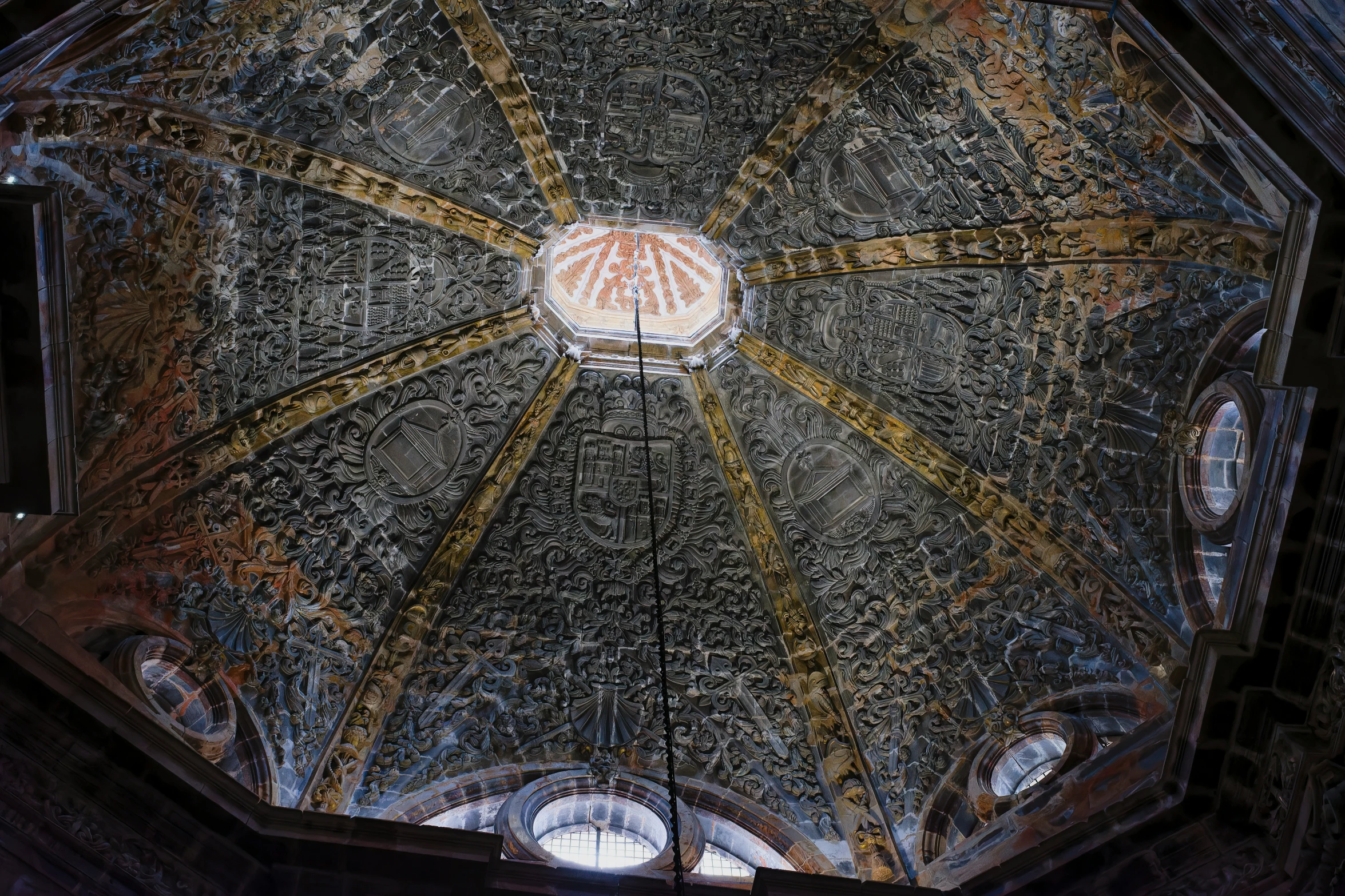 an intricately decorated dome ceiling in the middle of a building