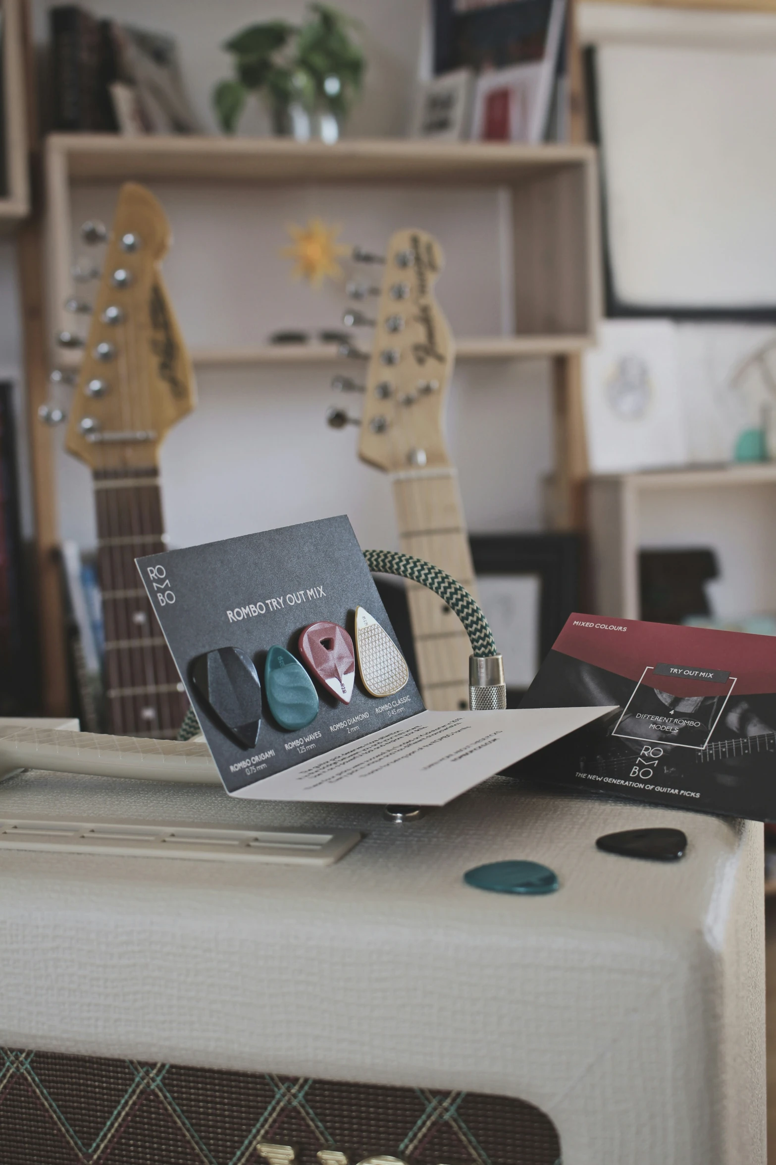 a guitar is shown with a cd and a sound processor