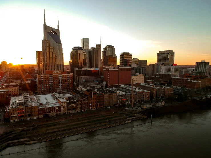 an aerial view of the city during sunrise