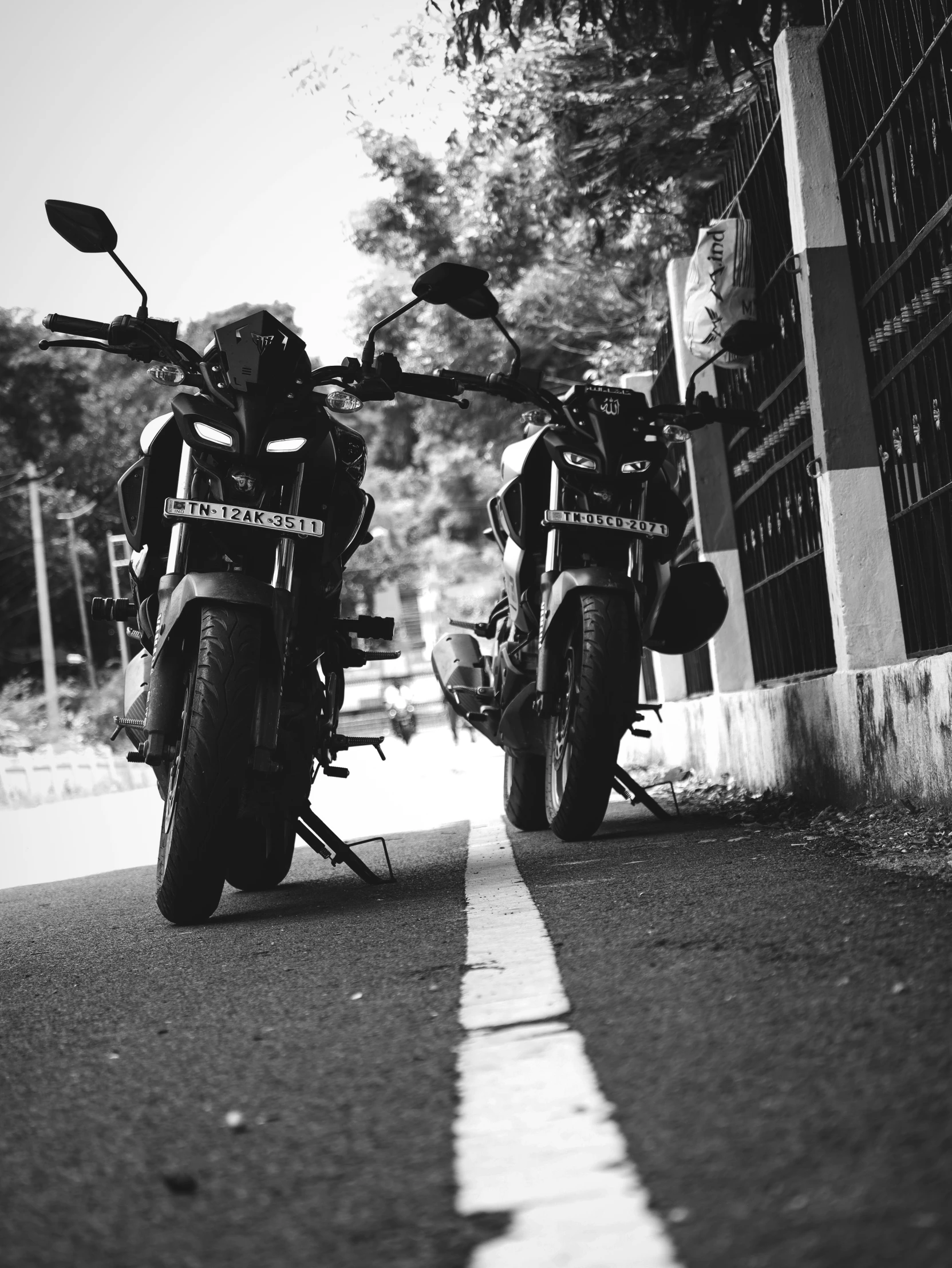 two motorcycles sitting parked next to each other