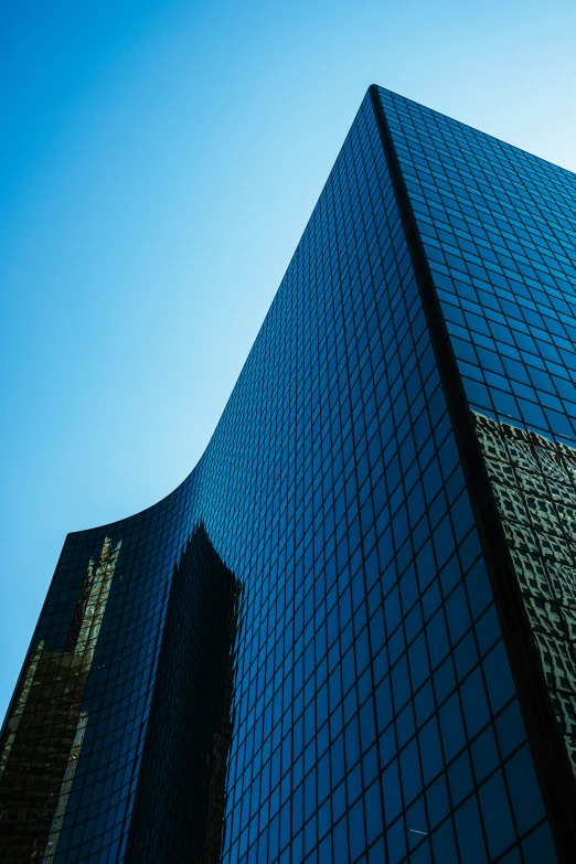 an upward view of a large building from the ground