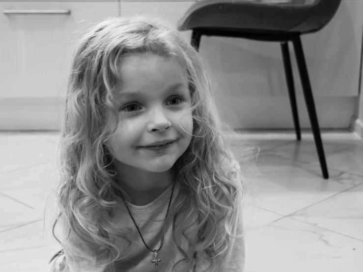 a black and white po of a little girl posing