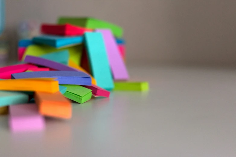 there are colorful erasers on the table