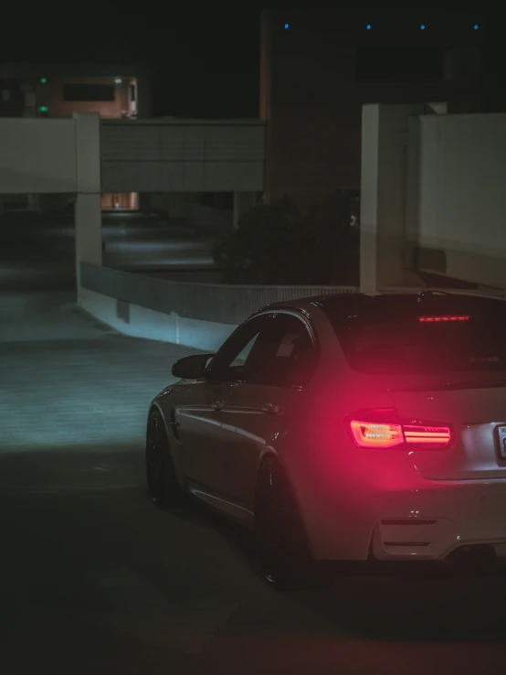 the back lights of a police car with its headlights on