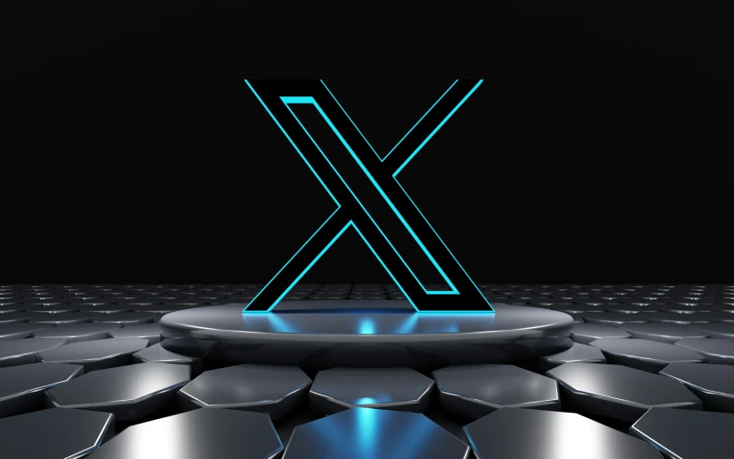 a stylized image of the letter x, in neon blue light