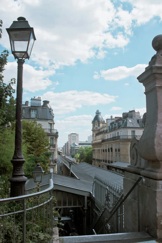 view of the rooftops and railings of old buildings in paris