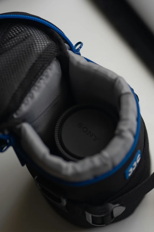 a pair of headphones sits next to the zipper of a case