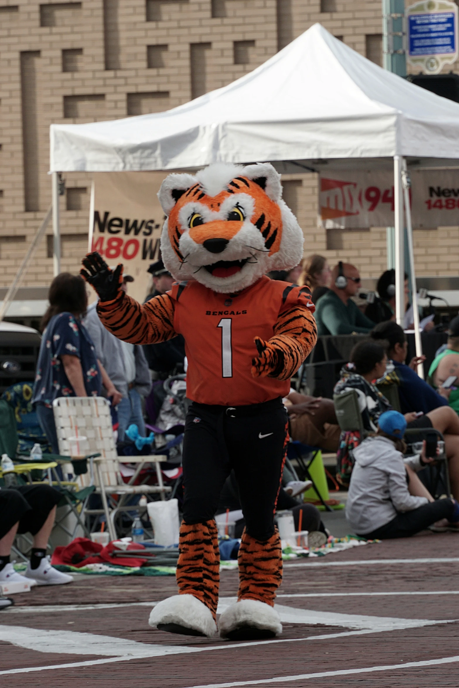 a person in a costume in front of a crowd