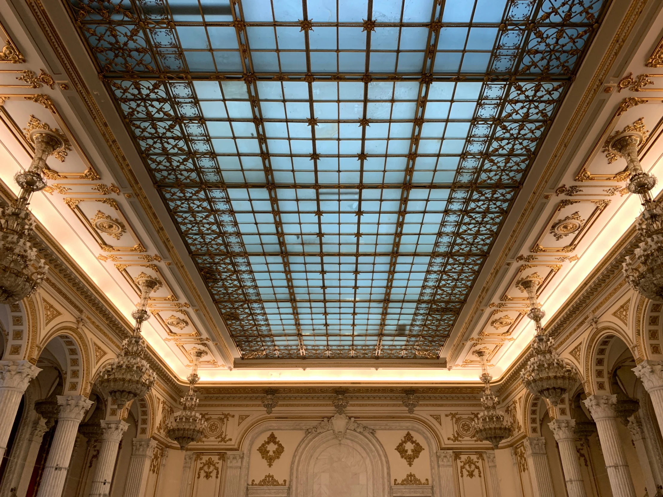 a blue and yellow skylight is hanging from the ceiling