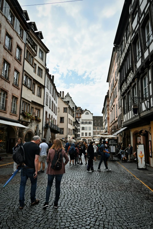 a group of people that are standing in the street