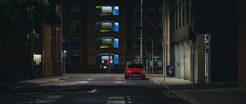 the back view of a bus parked on the side of a street