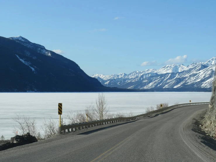 the street is winding through the mountain range