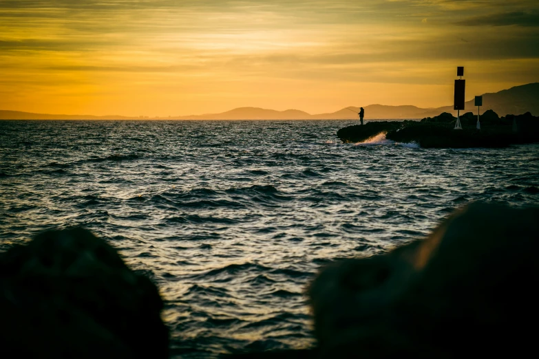 a view of the ocean at sunset from a boat